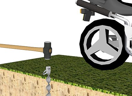 Le moyen facile de sécuriser une moto - marteler l'ancre, jusqu'au niveau du sol